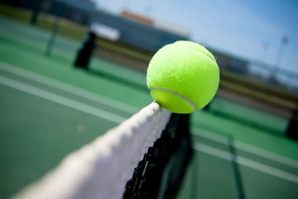 tennis ball at the net