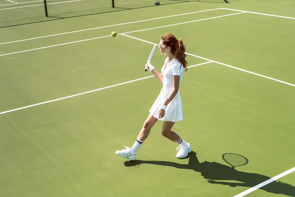 Women playing tennis in a skirt