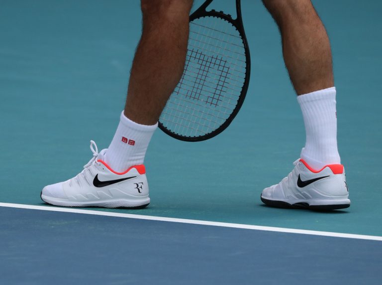 Why Do Tennis Players Wear Long Socks? - Tennis Hold