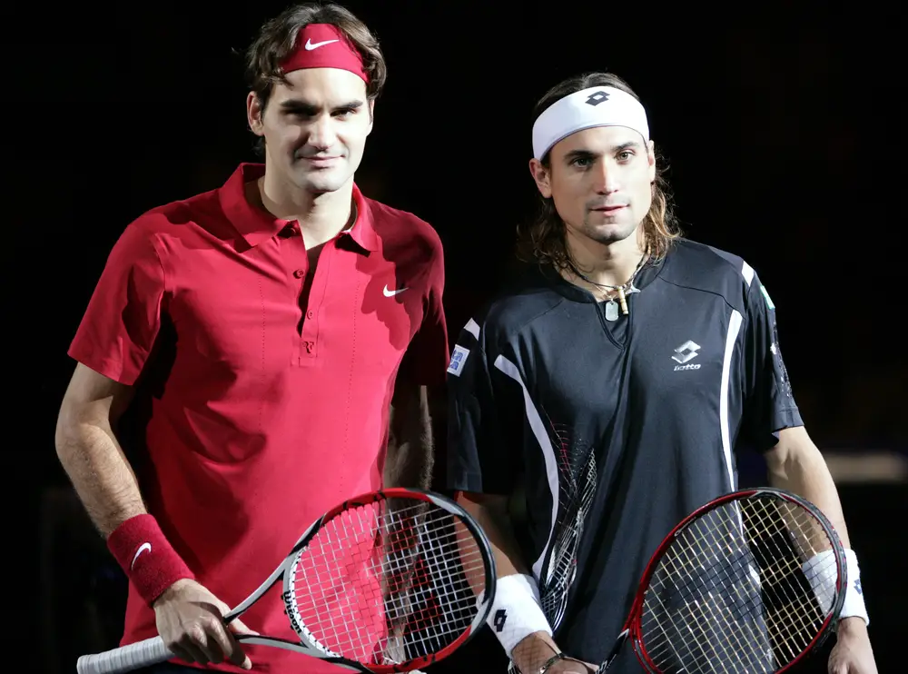 Roger Federer of Switzerland, left, poses with David Ferrer of Spain during the final of the Tennis Masters