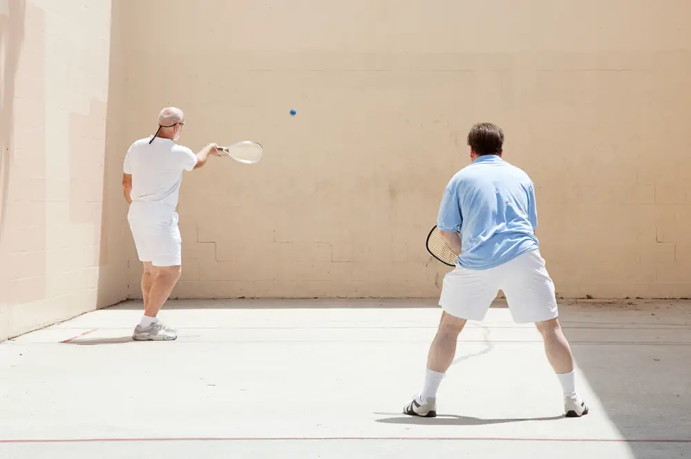 father and son, playing racquetball